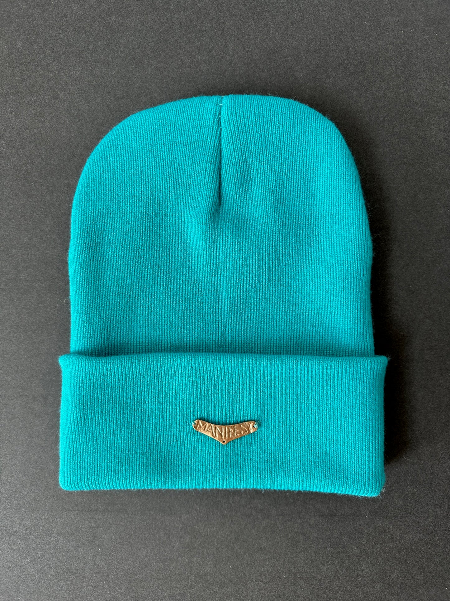 025. Bronze “MANIFEST” Beanie in turquoise